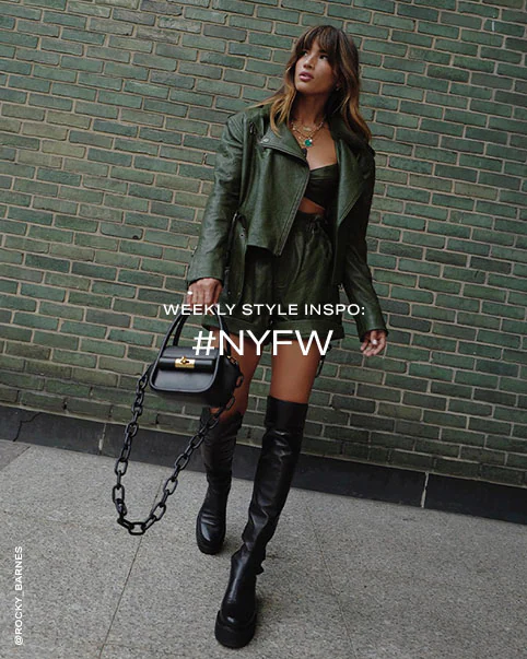 Rocky Barnes wearing a green leather crop top, matching jacket and shorts, and black knee-high boots. Weekly Style Inspo: #NYFW. Shop the Edit.